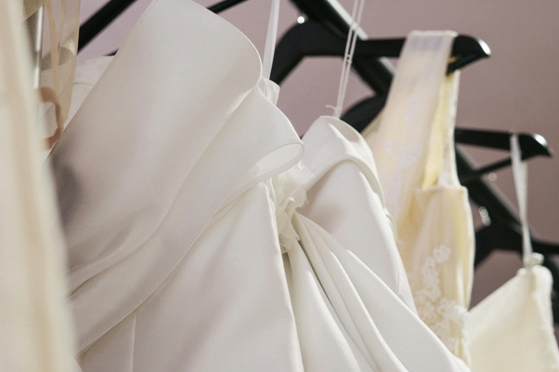 Elegant wedding gowns on display in a bridal shop